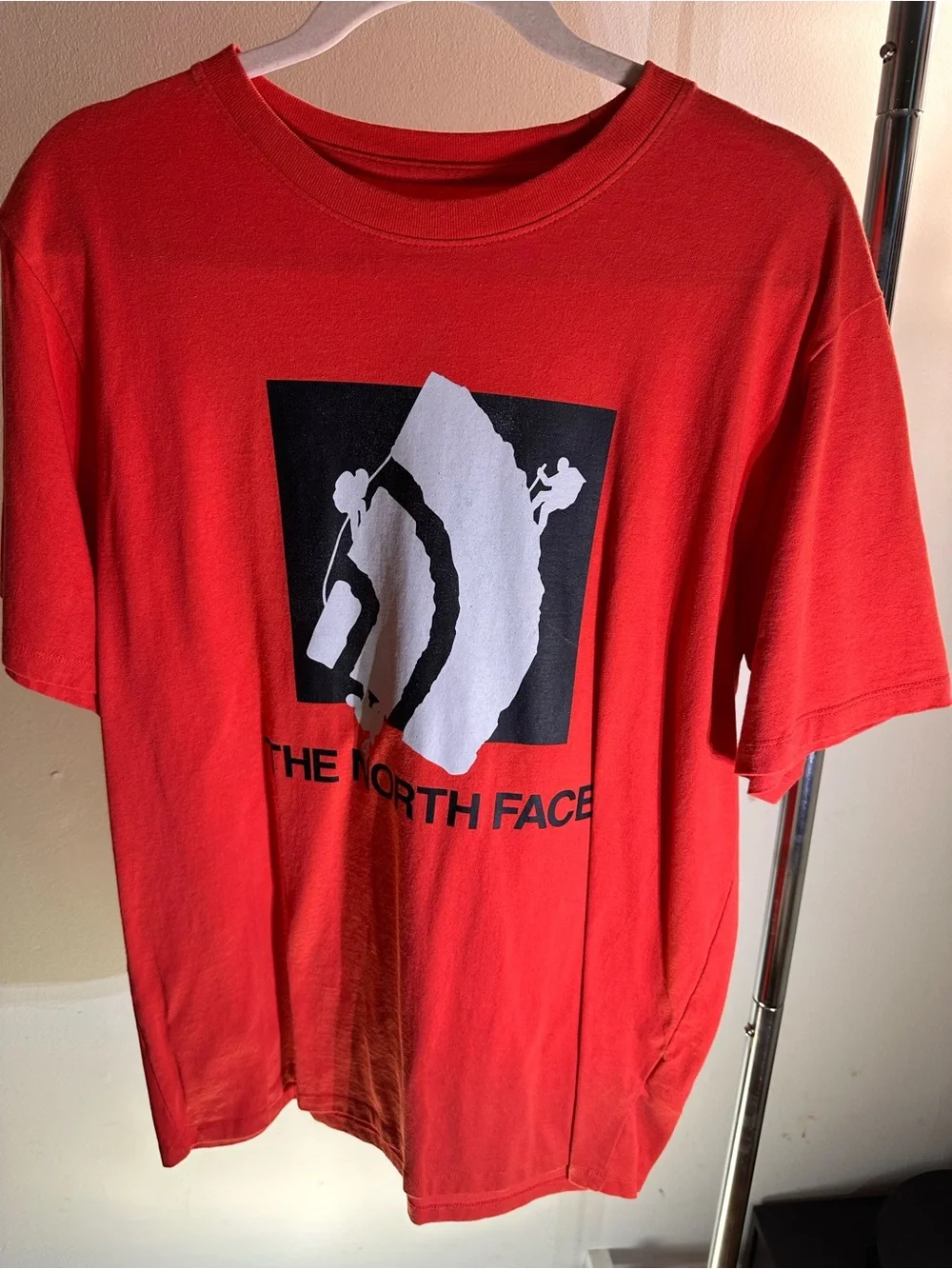 The North Face Red T‑Shirt with Black & White Mountain Climber Graphic